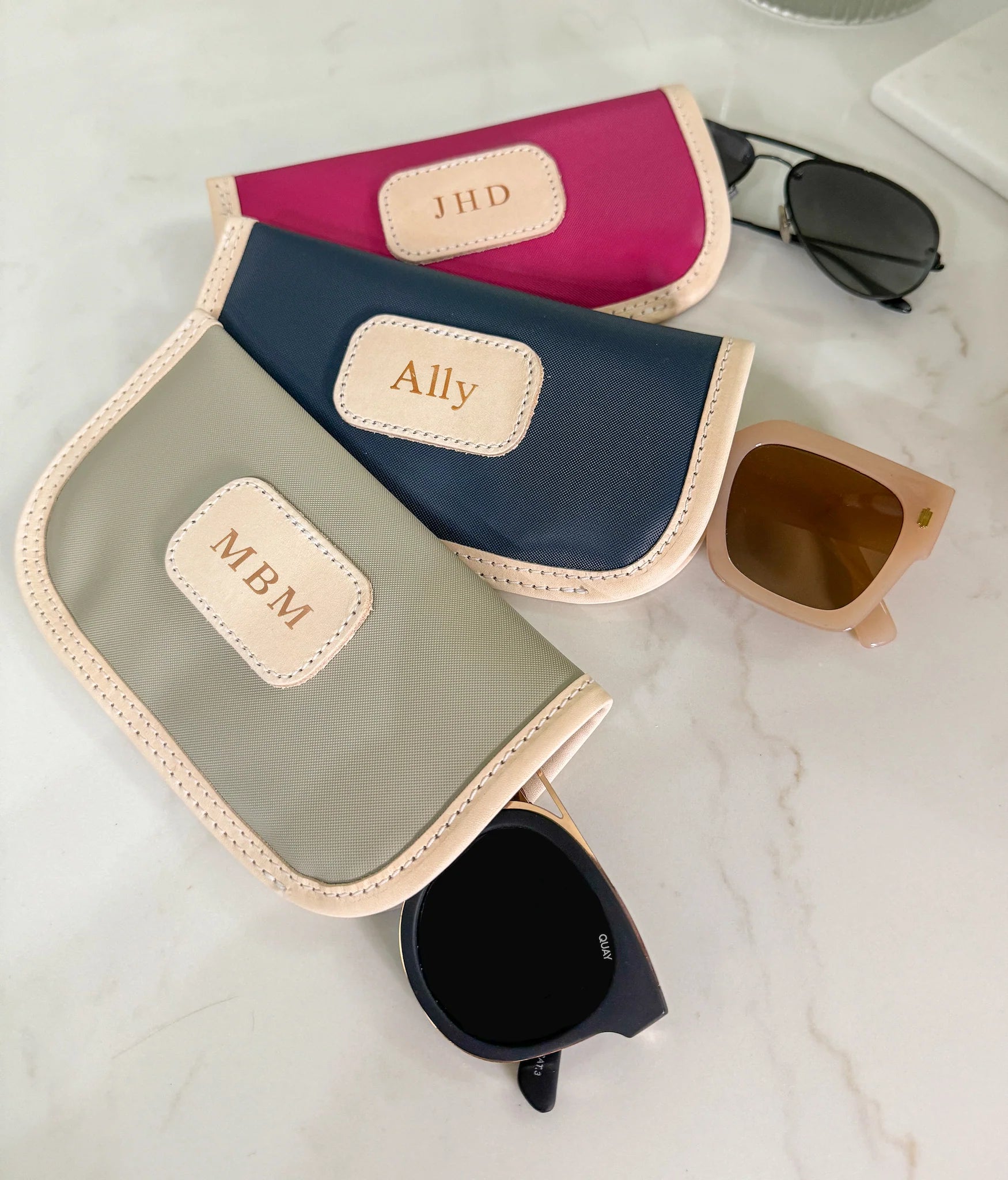 Jon Hart Glasses Case with coated canvas, leather trim, and gold zipper for durable, personalized protection.