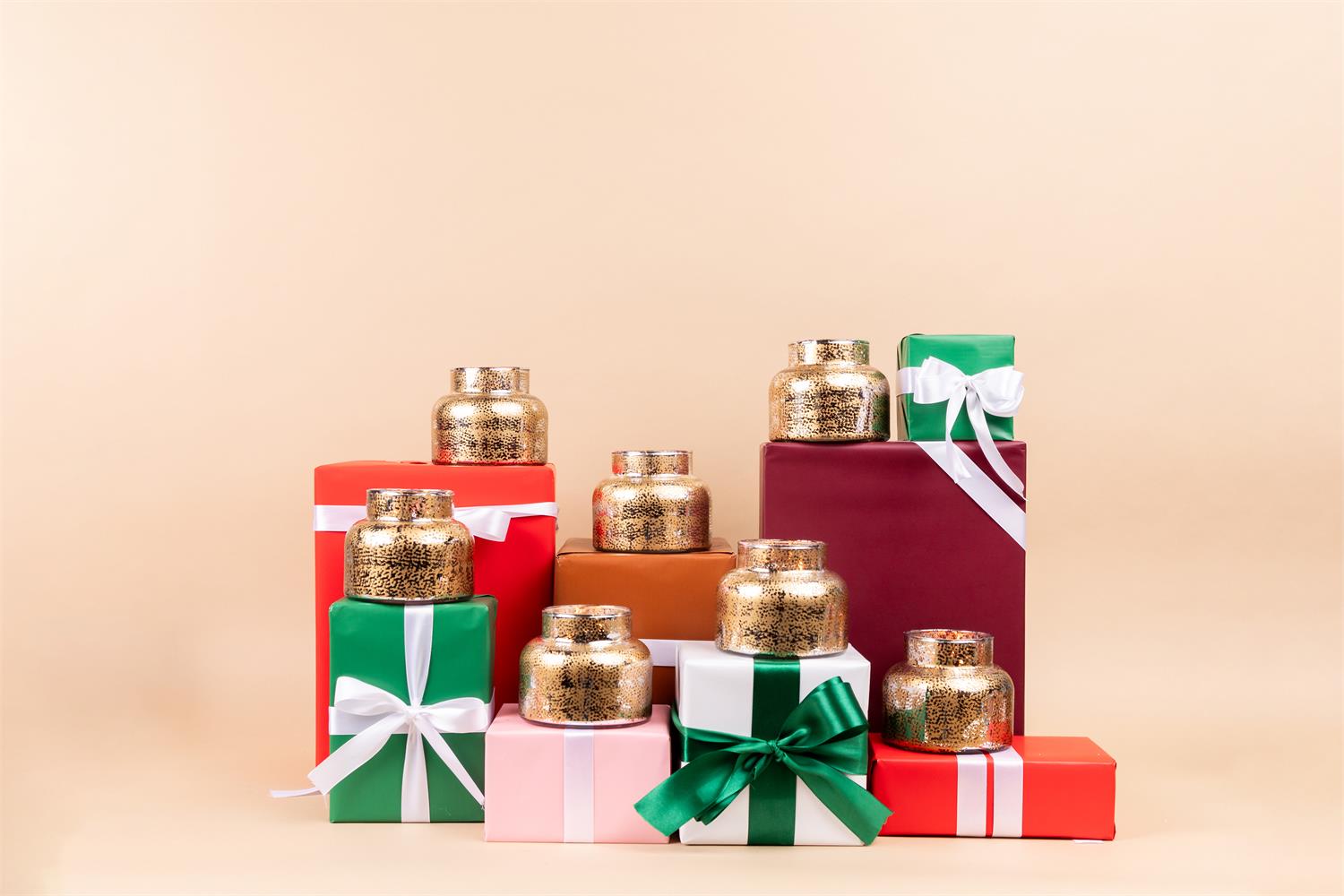 Sweet Grace Holiday Candle display on Christmas boxes.