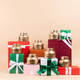 Sweet Grace Holiday Candle display on Christmas boxes.