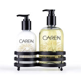 A 14 oz bottle of "Dazzle" hand wash and a 14 oz bottle of hand treatment sitting in a black sink-side caddy.