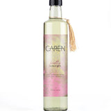 A sophisticated, clear glass bottle of "Pretty" bubble bath.