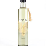 A sophisticated, clear glass bottle of "Loved" bubble bath.