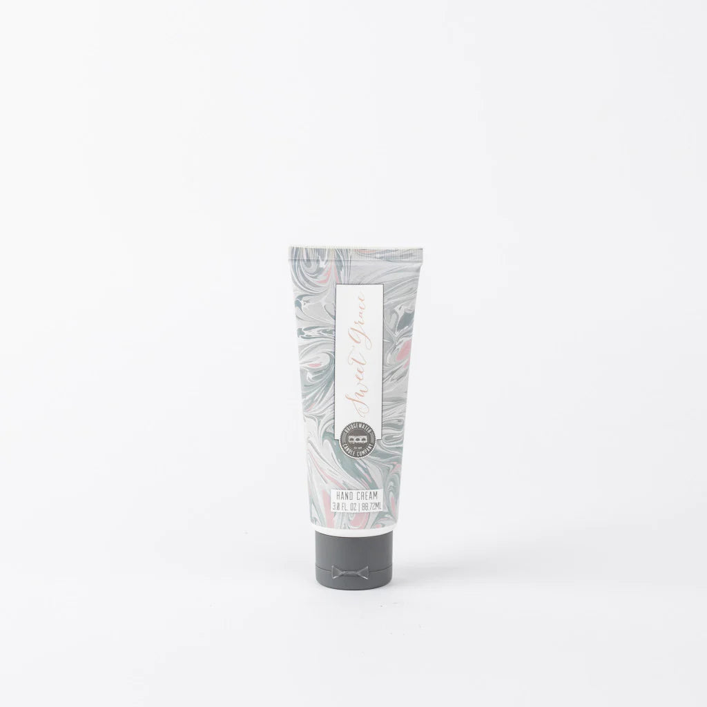 A tube of Sweet Grace hand cream with a floral pattern on the packaging. 3 ounces