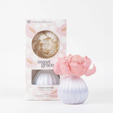 Flower diffuser with pink flower and packaging labeled 'sweet grace' on a white background