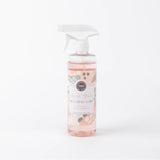 A pink spray bottle labeled 'Sweet Grace Multi Surface Cleaner' with a floral pattern.