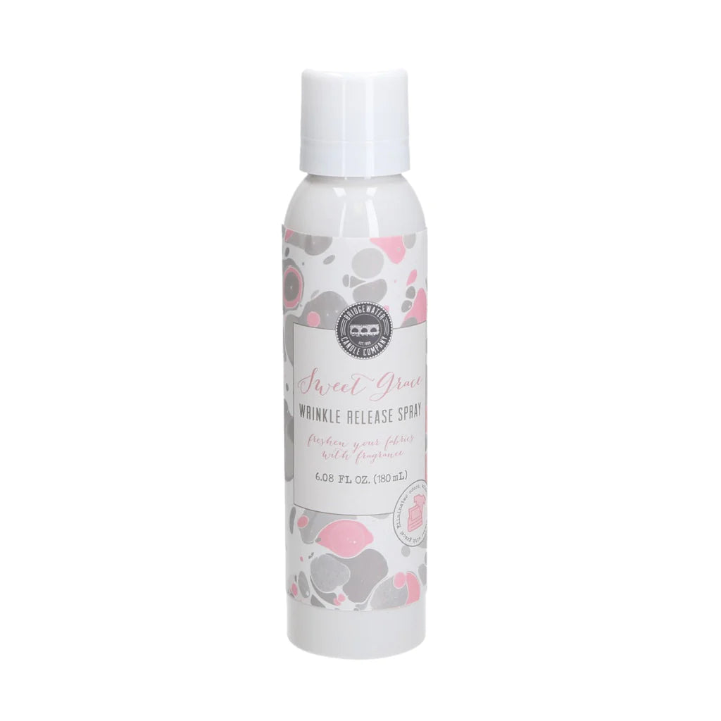 A bottle of Sweet Grace Wrinkle Release Spray with a floral design on the label.
