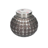 Sweet Grace candle in round graphite colored dot imprinted container.