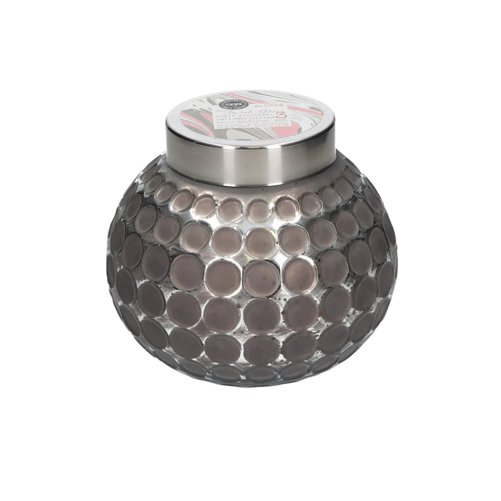 Sweet Grace candle in round graphite colored dot imprinted container.