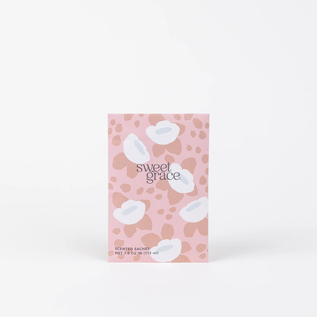 A sachet with a pink background and white flowers, labeled 'sweet grace'.