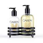 A 14 oz glass bottle of "Loved" hand wash and an 8 oz glass bottle of hand treatment.