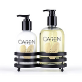 A 14 oz glass bottle of "Loved" hand wash and an 8 oz glass bottle of hand treatment.