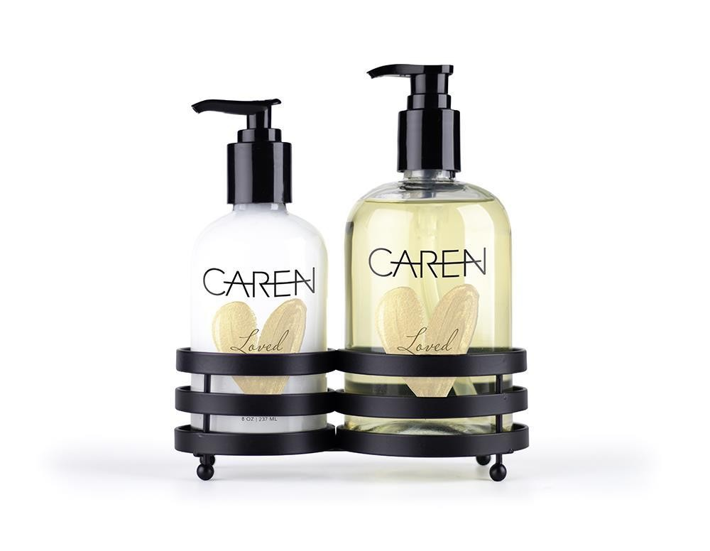 A 14 oz glass bottle of "Loved" hand wash and an 8 oz glass bottle of hand treatment.