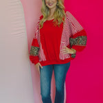 Video of Red, stripe, and leopard oversized Dolman style long sleeve sweatshirt.
