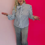 Video of Charcoal black striped front bow tie blouse.
