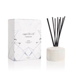 Volcano White Opal Gilded Reed Diffuser 7.75oz – tropical citrus-scented flameless diffuser in a white opal gilded glass vessel.