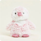 A soft, plush penguin toy that is primarily pink with a white belly, designed to be microwavable.