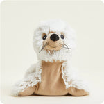 A soft, white plush seal toy with big dark eyes and whiskers, designed to be microwavable.
