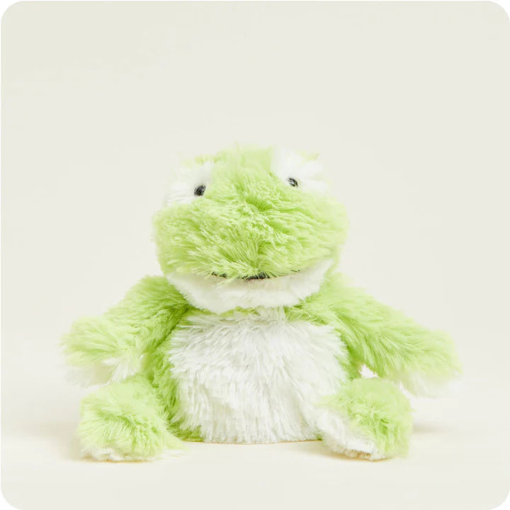 A small, soft green plush frog toy with friendly eyes, designed to be microwavable.