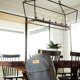 Jon Hart Large Backpack in durable coated canvas with natural leather trim, two main zip compartments, front and side pockets, adjustable leather-detailed straps, and a new trolley sleeve.