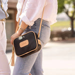 Jon Hart Lola Crossbody, 6.5x9x2.5 in, coated canvas with leather trim and tassel accent.