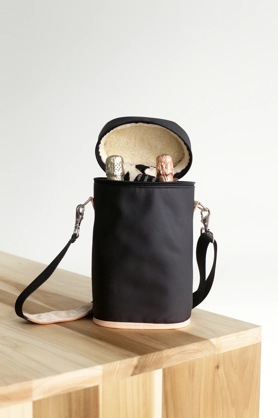 Jon Hart Double Wine Bag holds two bottles with fleece lining, leather accents, and detachable strap.