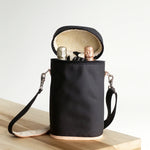 Jon Hart Double Wine Bag holds two bottles with fleece lining, leather accents, and detachable strap.