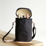 Jon Hart Double Wine Bag holds two bottles with fleece lining, leather accents, and detachable strap.