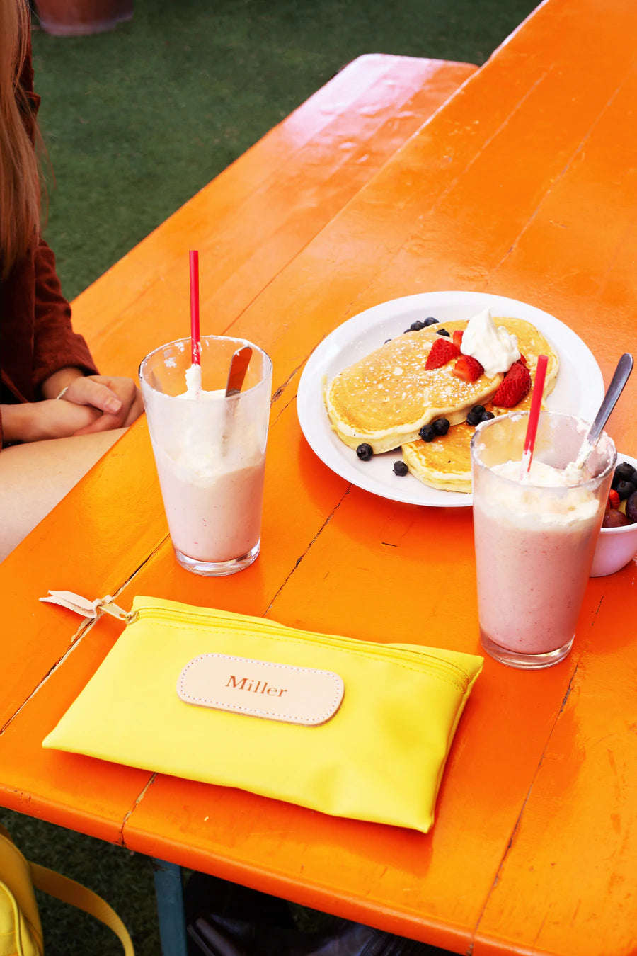 Jon Hart Pouch with coated canvas, leather details, and slim 6x9 design for stylish everyday organization.