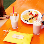 Jon Hart Pouch with coated canvas, leather details, and slim 6x9 design for stylish everyday organization.