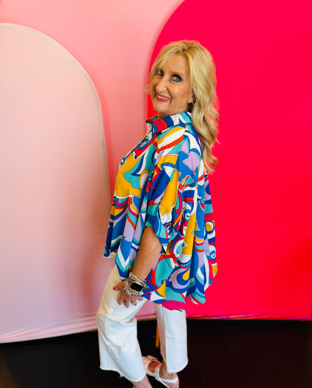 Side profile of the Blue Printed Blouse featuring the short dolman sleeves and flowy structure, showing movement and comfort in the design.