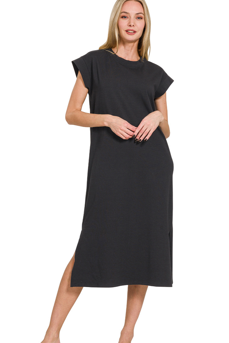 A solid black, short-sleeve midi dress with a round neckline. The dress is a soft, stretchy material with a side slit, and the length hits at mid-calf.