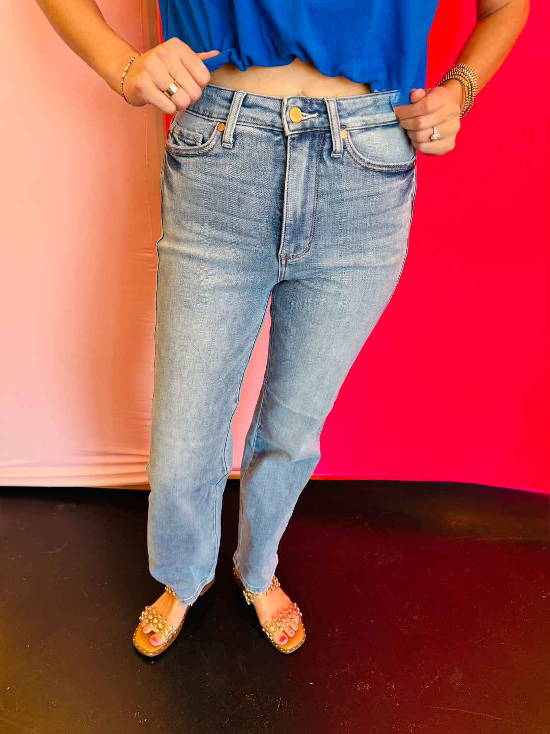 Front view of Judy Blue HW Tummy Control Straight Jeans highlighting the built-in tummy control panel, 11” high rise, and contrast wash detailing for a slimming effect.