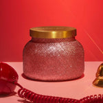 Capri Blue Apple Cider Social Glimmer Petite Candle with red finish and warm apple cinnamon scent.