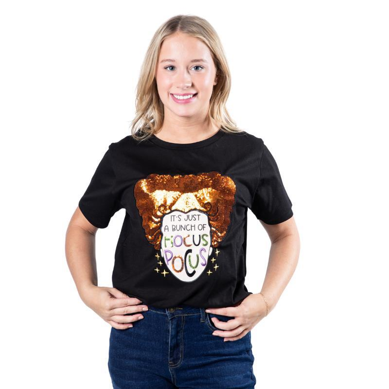 A black crewneck t-shirt featuring a glittery orange witch hat graphic. Below the hat, the text reads, "It's Just a Bunch of Hocus Pocus" in a stylized font.