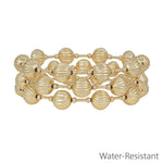 Set of three gold textured 10mm beaded stretch bracelets with water resistant finish