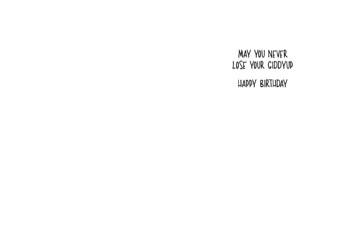 The inside of a birthday card that says May you never lose your giddyup. Happy Birthday. 