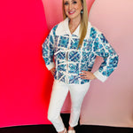 White cotton top with blue sequin Italian tiles, beaded accents, and tie-collar neckline.