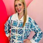 White cotton top with blue sequin Italian tiles, beaded accents, and tie-collar neckline.
