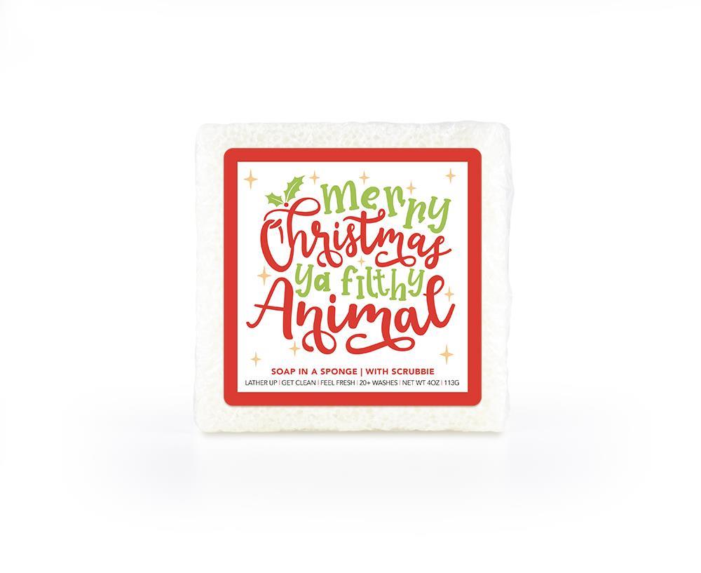 A festive, white, red and green, soap-infused sponge, with a whimsical label that reads "Merry Christmas Ya Filthy Animal." 