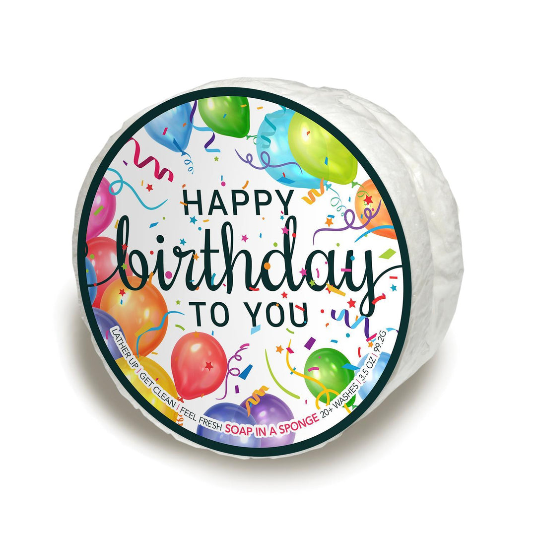 A cheerful, brightly colored soap-infused sponge with a festive "Happy Birthday To You" label.