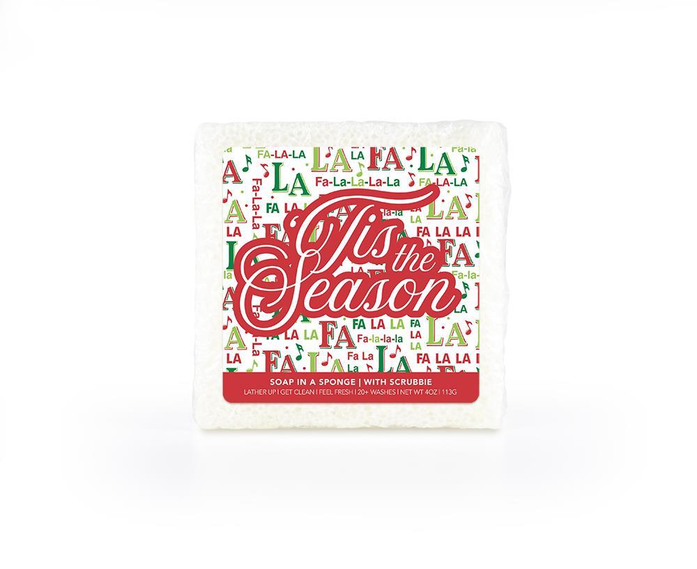 A festive soap-infused sponge, featuring a holiday-themed label that says "FaLaLa Tis the Season."