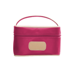 A Berry colored Jon Hart mini makeup case with natural leather trim and a leather patch for personalization.