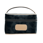 A dark leopard colored Jon Hart mini makeup case with natural leather trim and a leather patch for personalization.