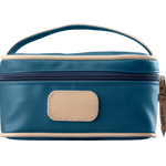 A french blue colored Jon Hart mini makeup case with natural leather trim and a leather patch for personalization.