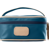 A french blue colored Jon Hart mini makeup case with natural leather trim and a leather patch for personalization.