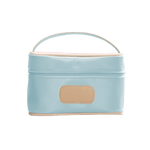 An ice blue colored Jon Hart mini makeup case with natural leather trim and a leather patch for personalization.