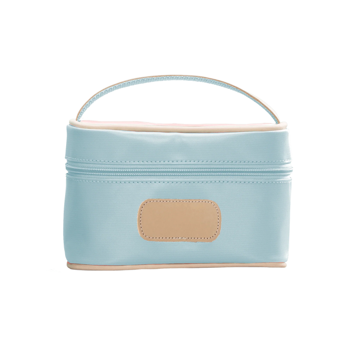 An ice blue colored Jon Hart mini makeup case with natural leather trim and a leather patch for personalization.