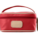 A red colored Jon Hart mini makeup case with natural leather trim and a leather patch for personalization.