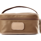 A saddle colored Jon Hart mini makeup case with natural leather trim and a leather patch for personalization.