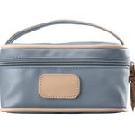 A slate colored Jon Hart mini makeup case with natural leather trim and a leather patch for personalization.